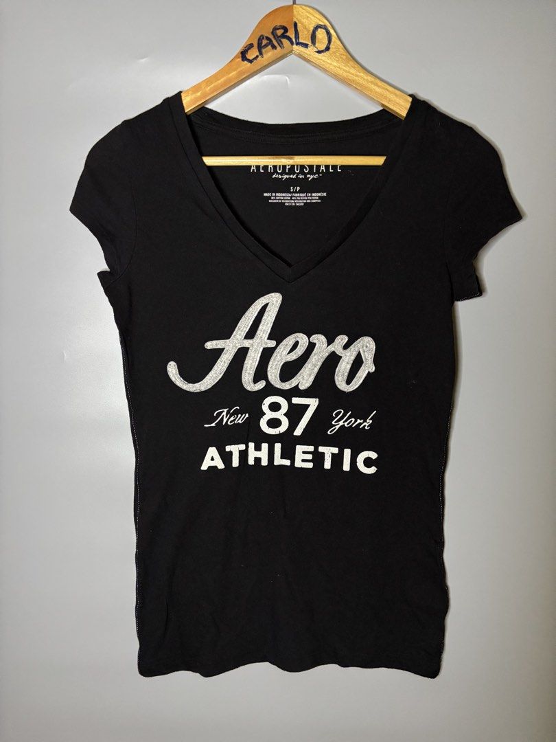 Y2K AEROPOSTALE T SHIRT (Category: Tshirts & Polo Shirts ) located in Bayambang. Submitted by lo_keythrifting (Listing ID 1466828370, Image 1). Description: - Brand: Aeropostale - Condition: Good as new - Dimes: 15.5*25 - Color rate: 10/10 - No issue - Color: Black - Size: S/P (Slim Fit) - Material: 60% Cotton, 40% Polyester - Design: V-neck with 'Aero New York 87 Athletic' front graphic - Condition: Brand new / Excellent pre-loved - Care: Machin