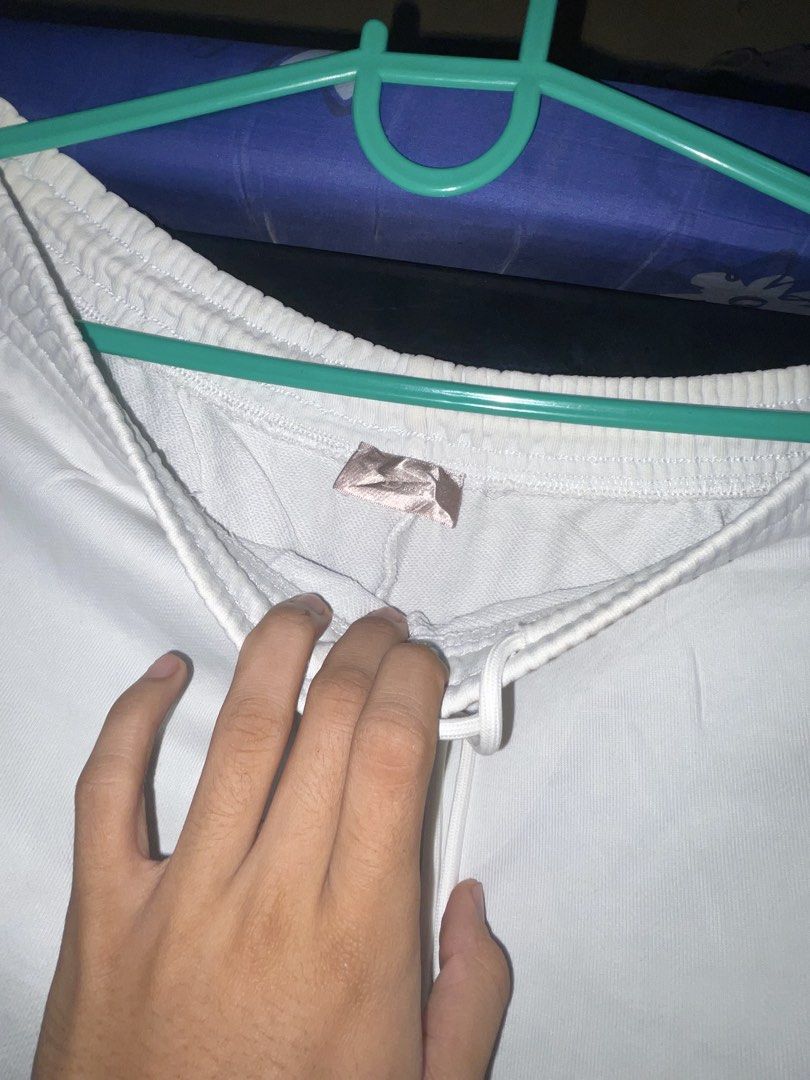 Air Dior White Sweatpants Joggers (Category: Luxury Apparel) located in Manila. Submitted by jabjabthriftplace (Listing ID 1466807658, Image 3). Description: - Authentic Air Dior collaboration sweatpants in pristine white - Features iconic embroidered Air Dior wing logo on the left leg - Comfortable elastic waistband with adjustable drawstring - Stylish cuffed ankles and relaxed fit for daily wear - Soft, premium fabric for ultimate comfort - Com