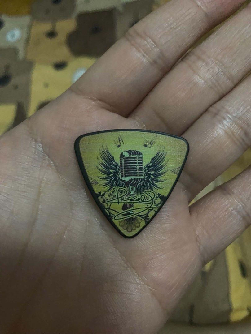 Air supply guitar pick Russell (Category: Music Accessories) located in Paranaque City. Submitted by arckadyo (Listing ID 1466775338, Image 1). Description: FOR SALE: AIR SUPPLY GUITAR PICK 🎸 This guitar pick was personally handed to me by Russell Hitchcock of Air Supply at NAIA Terminal 1 when they were here in the Philippines for their 2026 concert. A very special and rare souvenir for Air Supply fans and collectors. ❤️ Personally received fro