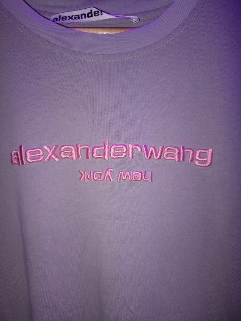 Alexander Wang Logo T-shirt Size M (Category: Shirts) located in Manila. Submitted by naixhrift (Listing ID 1466847213, Image 3). Description: - Brand: Alexander Wang Shirt - Size: M to L - Color: Grey with pink embroidered chest logo and upside-down 'new york' lettering - Origin: Made in Turkey - Length 27 - Width 22 880 plus ship jnt courier payment on gcash for trusted only manila area.