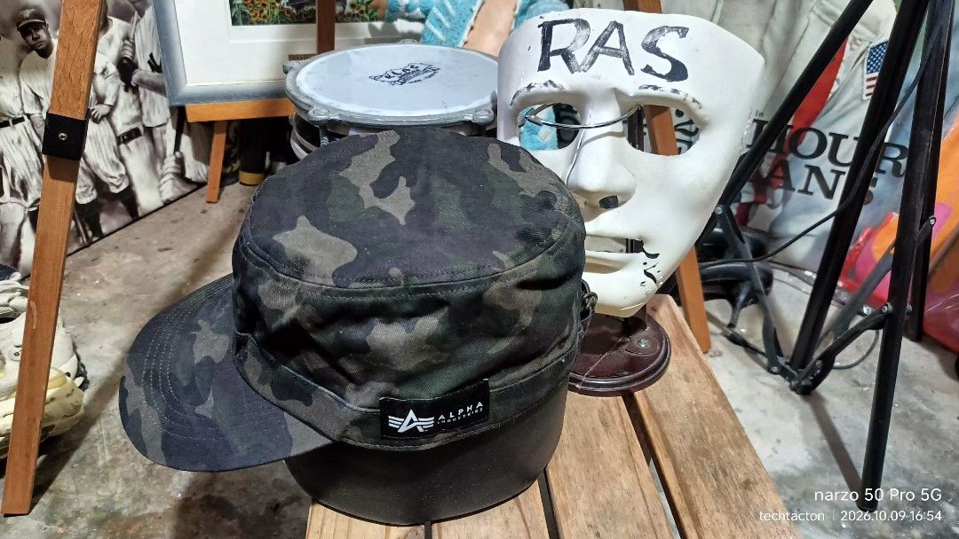 Alpha Industries Camouflage Cadet Cap Army Hat (Category: Caps & Hats) located in Santo Tomas. Submitted by pickers_corner (Listing ID 1466969819, Image 1). Description: ALPHA INDUSTRIES military cap size M 57-59cm excellent condition - Brand: Alpha Industries - Design: Green and black camo pattern, military cadet style with flat top and stiff brim - Size: Adjustable 57 to 59 cm with metal buckle strap - Details: Small branded logo tag near the b