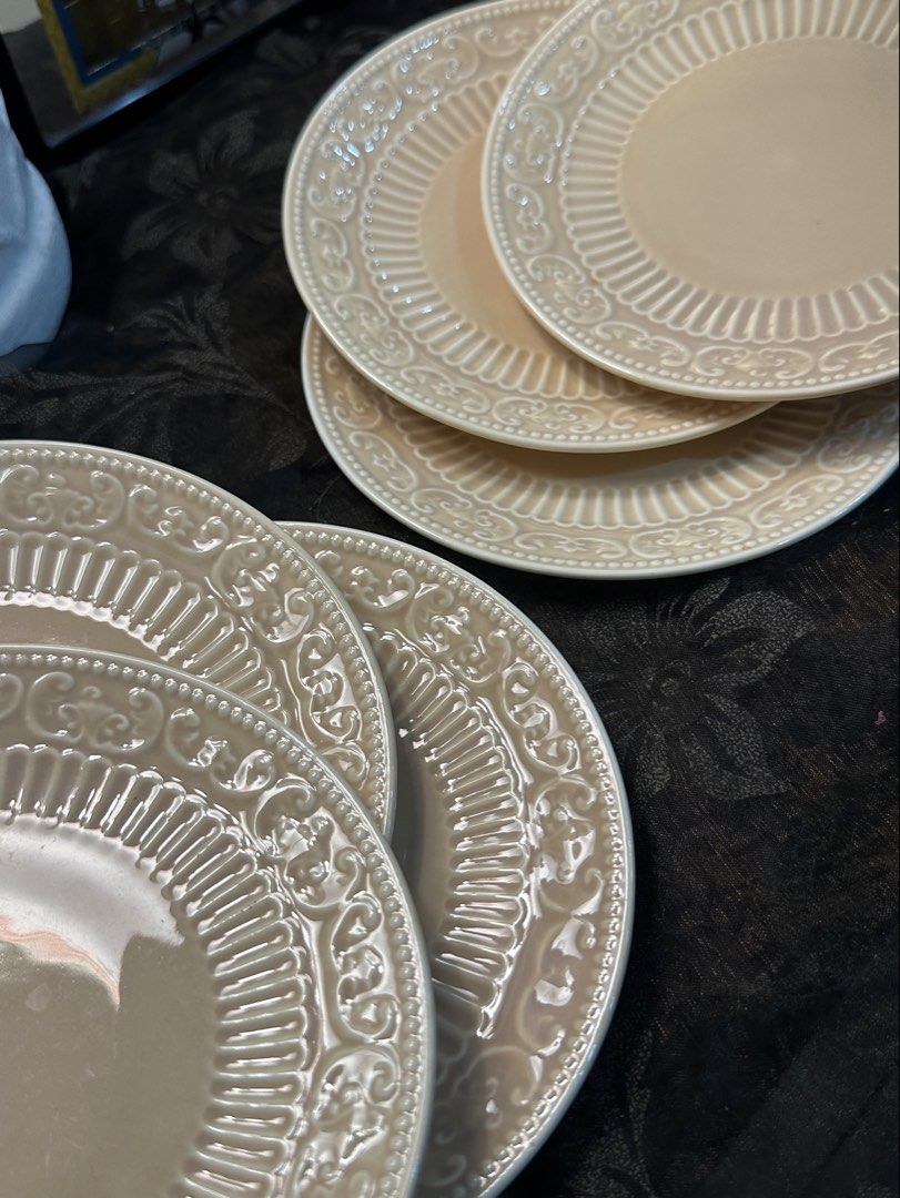 Alsaif Gallery Beige Decorative Dinner Plates Set (Category: Dinnerware & Cutlery) located in Manila. Submitted by tenshiii185 (Listing ID 1466913901, Image 3). Description: - Brand: Alsaif Gallery - Color: Soft beige tone - Design: Intricate embossed scroll and fluted border with a smooth glossy center - Origin: Made in China - Condition: Matching set, stacked neatly - Best for: Elegant dining table setup or kitchen display.