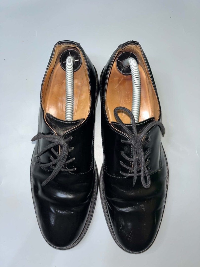 Ami Paris Black Leather Derby Shoes (Category: Dress Shoes) located in Pagadian. Submitted by smoothproc. (Listing ID 1466929524, Image 1). Description: - Brand: Ami Paris - Style: Black leather derby shoes with a glossy finish - Details: Classic lace-up closure, rounded toe profile, sturdy stacked heel, and leather lining with branded insoles - Condition: Shows normal scuffs and creasing from regular wear; soles have decent tread left - Versatil