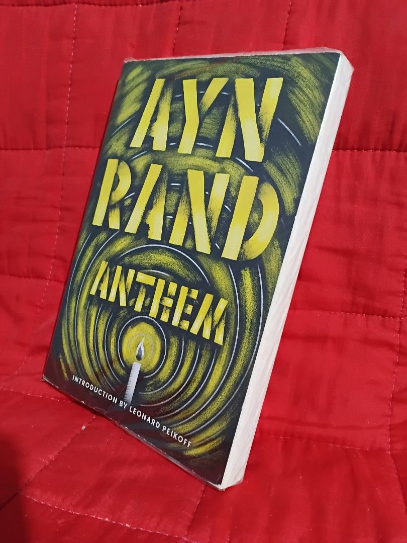 Anthem by Ayn Rand Paperback Book (Category: Storybooks) located in Manila. Submitted by krishna_ayanami (Listing ID 1466887386, Image 2). Description: - Title: Anthem by Ayn Rand - Genre: Classic dystopian novella (Individualism vs. Collectivism) - Format: Paperback with distinctive yellow/black cover art - Features: Includes introduction by Leonard Peikoff - Condition: Clean pages, excellent for reading and collecting.