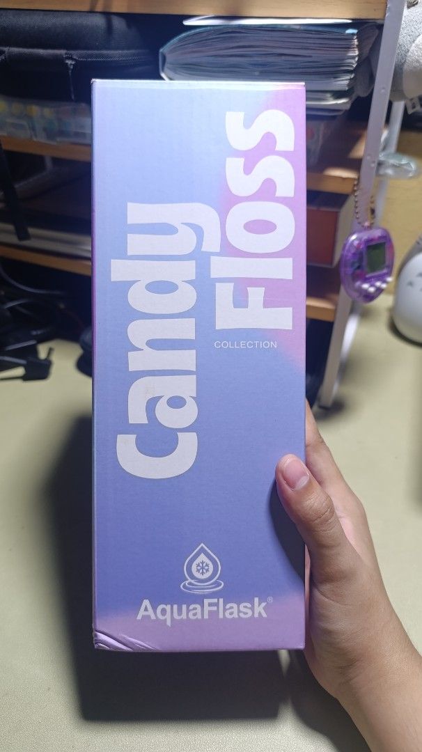 AquaFlask 32 oz Candy Floss Blueberry Puffer (Read Desc!!) (Category: Water Bottles & Tumblers) located in Manila. Submitted by franzbookcorner (Listing ID 1466847721, Image 2). Description: - Brand: AquaFlask - Size: 32 oz - Collection: Candy Floss Collection - Colorway: Blueberry Puffer (Purple gradient finish with a sparkly texture) - Inclusions: Matching purple silicone boot and original box - Condition: Lightly used, has broken vacuum seal/i