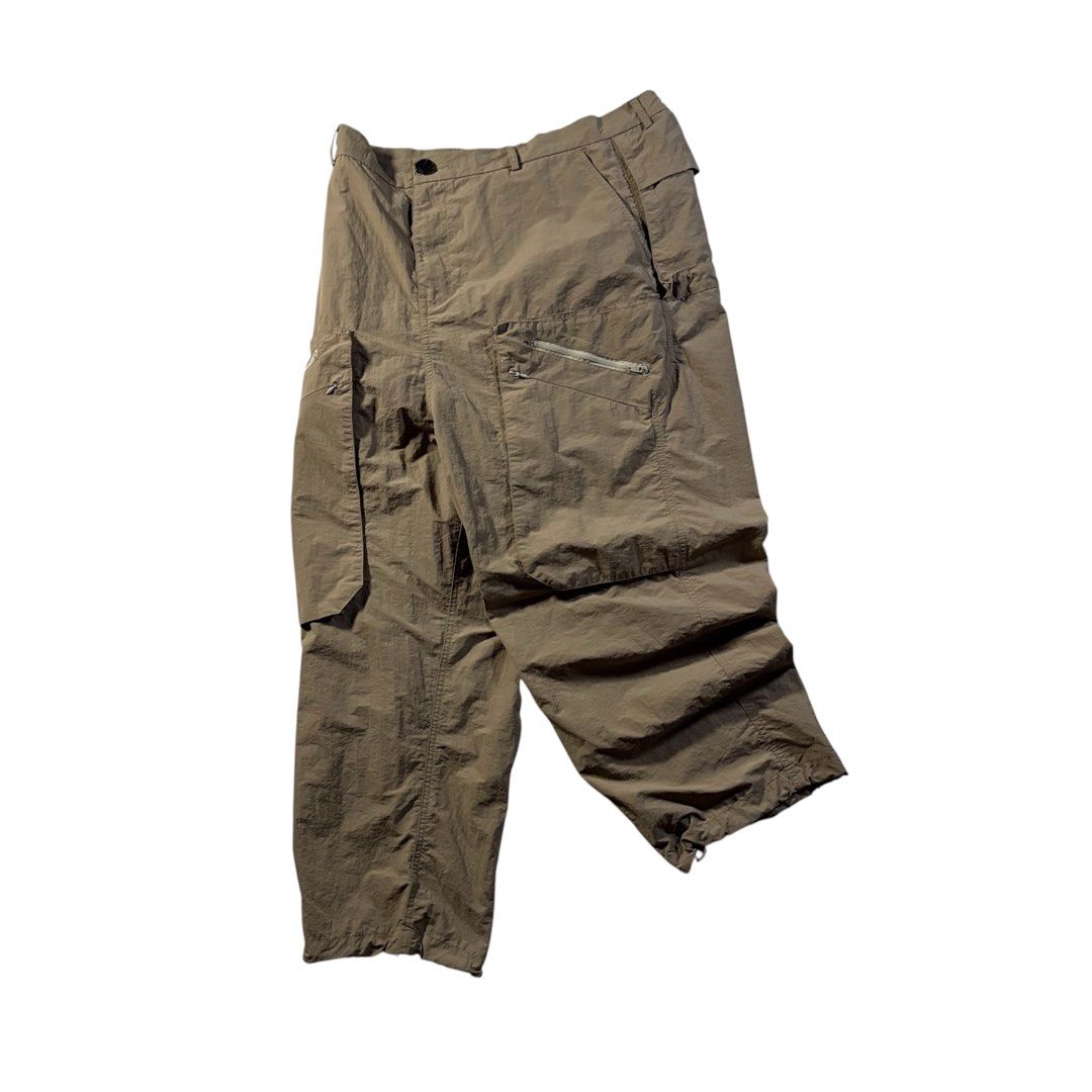 Archival Reinvent JP 3D Multipocket 2.5 Disk Nylon Pants in Brown (Category: Trousers) located in Manila. Submitted by yama_archive (Listing ID 1466915557, Image 1). Description: Archival Reinvent JP 3D Multipocket 2.5 Disk Nylon Pants in Brown Dimes (inches starting from 0) — - Size on tag: XL - Waist: 36 - Length: 36.5 - Thigh: 14.5 - Leg Opening: 9 ₱2000 Issues: ❌ Condition: 10/10 Color rate: 10/10.