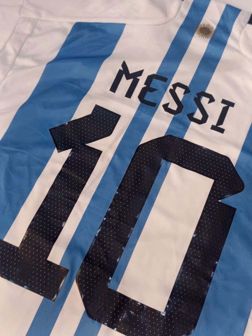 Argentina HomeShirt Cup Messi 10 (Category: Activewear) located in Tacloban City. Submitted by agnescthrifted98 (Listing ID 1466796273, Image 2). Description: in Excellent Condition yung quality niya may mile dumi lang pero can be remove na stock lang sa cabinet. 22x31.5 inches.