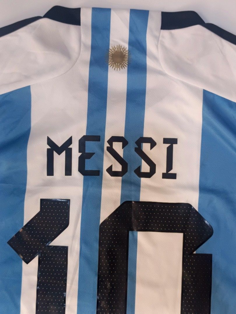 Argentina HomeShirt Cup Messi 10 (Category: Activewear) located in Tacloban City. Submitted by agnescthrifted98 (Listing ID 1466796273, Image 3). Description: in Excellent Condition yung quality niya may mile dumi lang pero can be remove na stock lang sa cabinet. 22x31.5 inches.