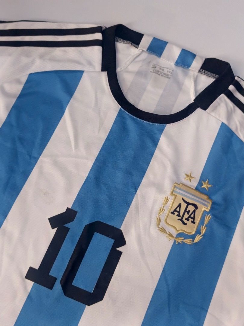 Argentina HomeShirt Cup Messi 10 (Category: Activewear) located in Tacloban City. Submitted by agnescthrifted98 (Listing ID 1466796273, Image 1). Description: in Excellent Condition yung quality niya may mile dumi lang pero can be remove na stock lang sa cabinet. 22x31.5 inches.