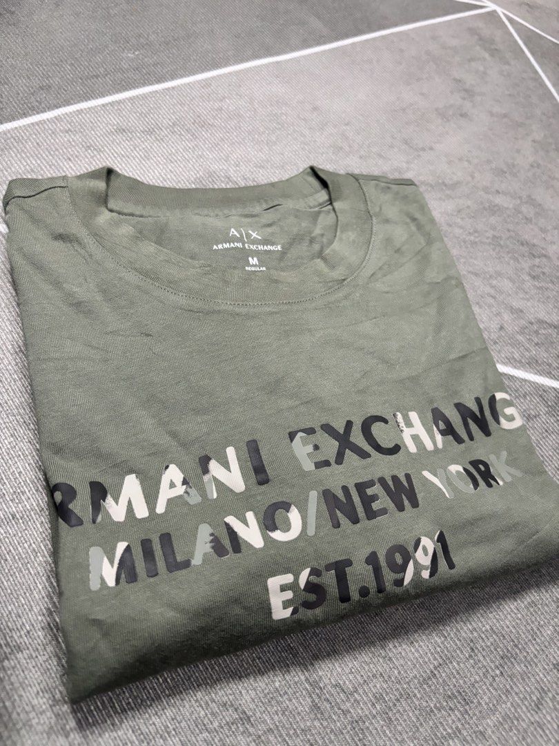 ARMANI EXCHANGE (Category: Tshirts & Polo Shirts ) located in Manila. Submitted by anthony_stark (Listing ID 1466913556, Image 1). Description: Armani exchange script camou Good as new / NO ISSUE MEDIUM ON TAG Width 22 Length 29 Cebu city 650+SF.