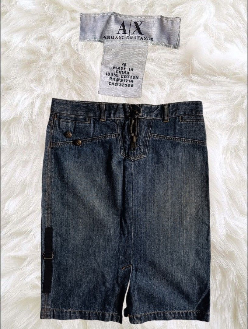 Armani Exchange Denim Skirt Size 4 (Category: Skirts) located in Abucay. Submitted by lovedby.herrr (Listing ID 1466829610, Image 1). Description: Brand new with tags Armani Exchange dark blue denim skirt, size 4. Made of 100% cotton with a front zip, cool pocket details, and a stylish side strap..
