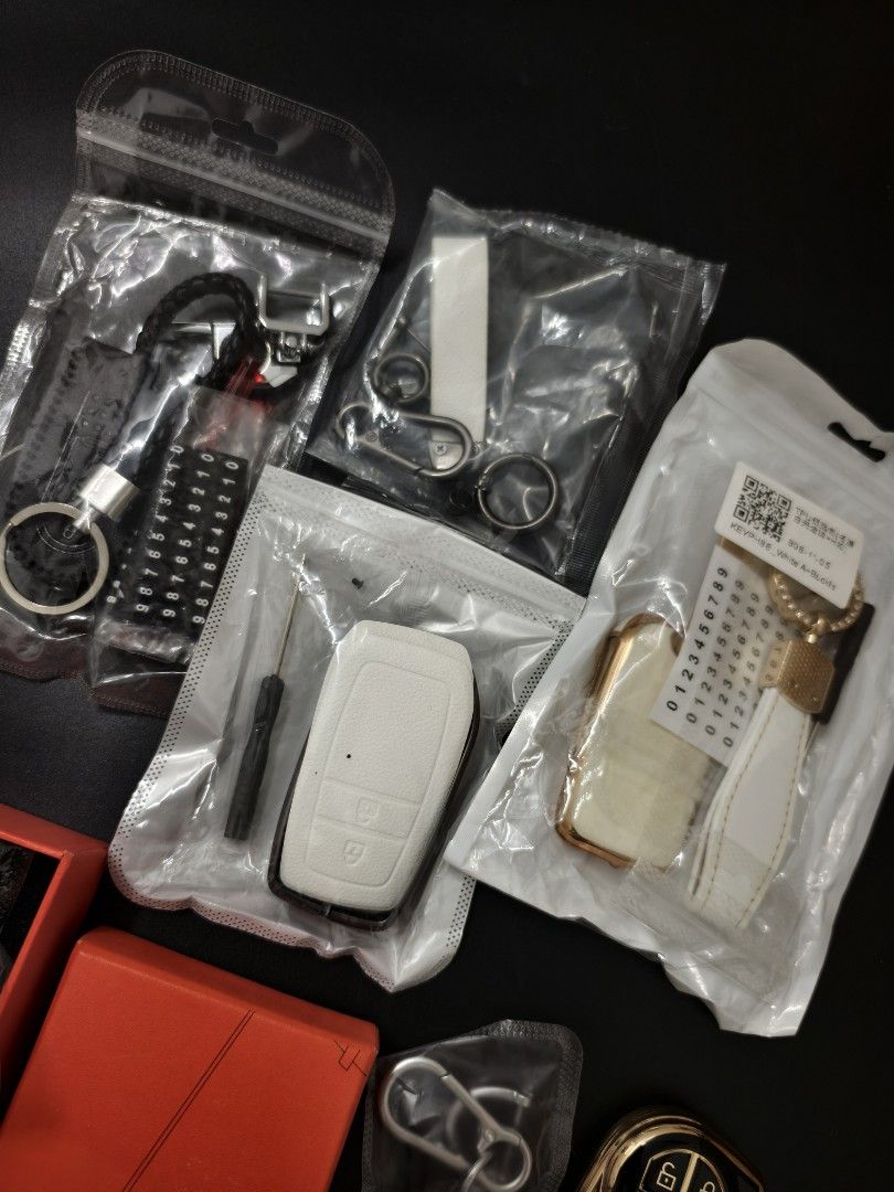 Assorted Car Key Fob Covers and Keychains (Category: Cases & Sleeves) located in Angeles City. Submitted by measaliman02351 (Listing ID 1466887584, Image 2). Description: - Brand new car key fob protective cases and matching keychain bundles - Assorted styles: white leatherette, black and metal designs, and black with gold trim - Selected sets include a mini screwdriver for easy installation and a phone number plate - All items are brand new and 