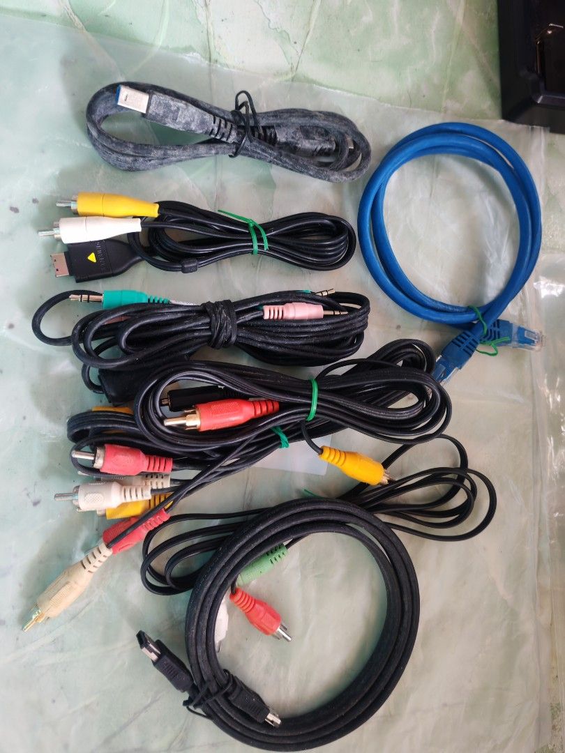 Assorted Display, Audio, and Data Cables Bundle (Category: Cables & Adaptors) located in Trece Martires City. Submitted by chipmaster74 (Listing ID 1466780530, Image 2). Description: - Assorted cable bundle: DVI, VGA, Ethernet, RCA audio, USB, and eSATA - Includes multiple lengths and various connector styles - Perfect for computer setups, older monitors, and home entertainment systems - Items are dusty from storage and need a quick wipe down bef