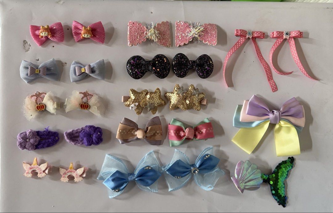 Assorted Kids Hair Clips and Bows Set (Category: Hair Accessories) located in Binan City. Submitted by prelovedlagunaph (Listing ID 1466968418, Image 1). Description: - Complete hair accessories bundle sold as a set - Includes: pink bows, glitter stars, dark sparkly bows, blue sheer bows, unicorn horns, knit flowers, and a large multi-colored pastel bow - Features a bonus mermaid tail clip - Great variety for daily styling or special occasions - 