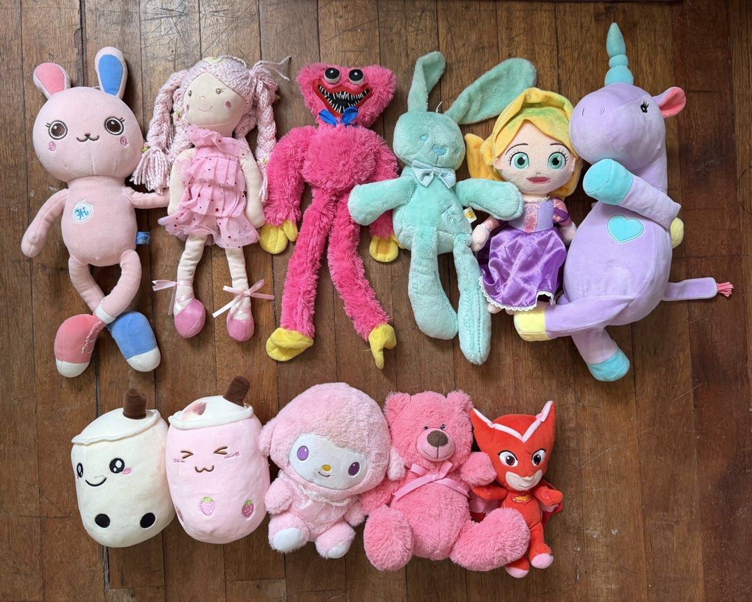 Assorted Plush Toys Soft Dolls Collection (Category: Plushies & Soft Toys) located in Binan City. Submitted by prelovedlagunaph (Listing ID 1466968121, Image 1). Description: - Assorted plush toy bundle in clean condition - Includes: Pink bunny, mint green bunny, rag doll, Huggy Wuggy, princess character, purple unicorn, boba tea plushies, My Melody, pink teddy bear, and Owlette superhero - Various sizes and characters - Ideal for kids, collector
