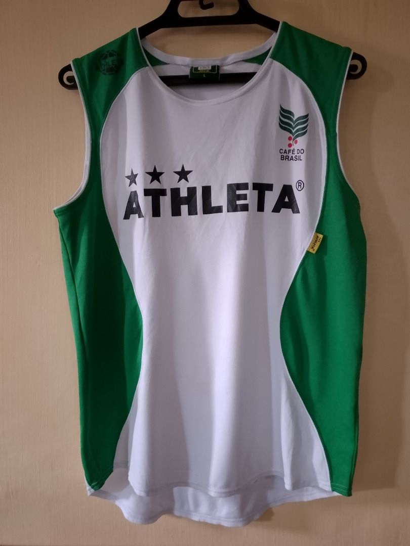 Athleta Cafe do Brasil Tanktop Drifit Jersey (Category: Sleeveless) located in Bayombong. Submitted by daily10 (Listing ID 1466876706, Image 2). Description: - Brand: Athleta (Café Do Brasil Collection) - Size: Large (L) - Dimensions: 20" x 25f" x 27.5b" - Issues: minor nicks, see last 2 pics - Color: Green and white with contrasting green side panels - Design: Bold front Athleta logo with three stars, small green side seam tag - Material: Breath