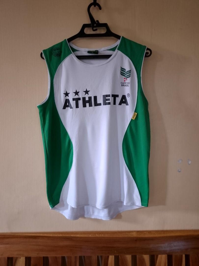 Athleta Cafe do Brasil Tanktop Drifit Jersey (Category: Sleeveless) located in Bayombong. Submitted by daily10 (Listing ID 1466876706, Image 1). Description: - Brand: Athleta (Café Do Brasil Collection) - Size: Large (L) - Dimensions: 20" x 25f" x 27.5b" - Issues: minor nicks, see last 2 pics - Color: Green and white with contrasting green side panels - Design: Bold front Athleta logo with three stars, small green side seam tag - Material: Breath
