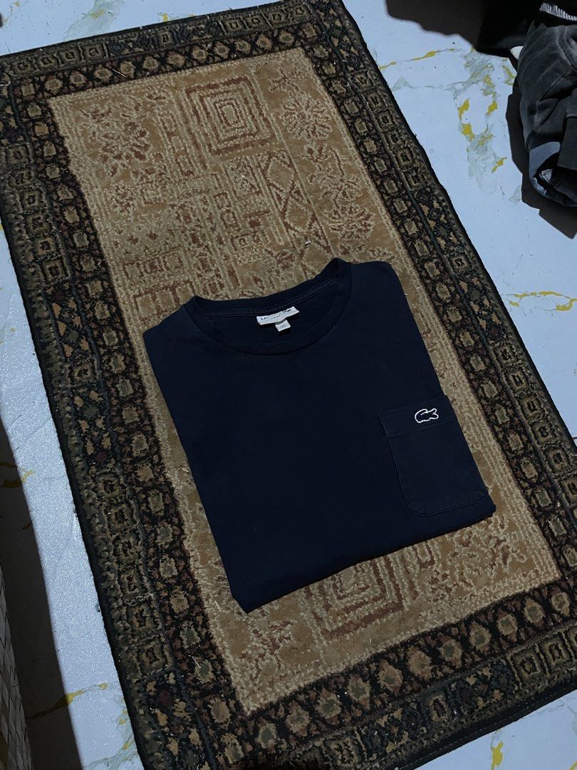 AUTHENTIC LACOSTE POCKET TEE NAVY BLUE COLORWAY (Category: Tshirts & Polo Shirts ) located in Cagayan de Oro. Submitted by dwight_666 (Listing ID 1466779555, Image 1). Description: medium on tag 21x27 complete tag good condition flawless no issue color rate: 9/10 .