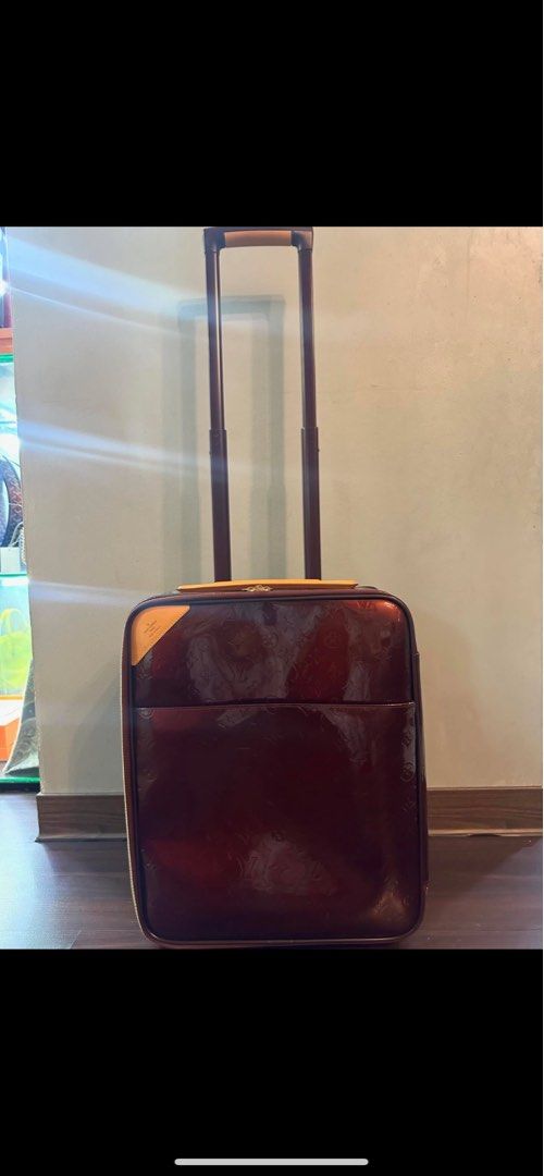 Authentic Louis Vuitton Pegase 45 Monogram Vernis Burgundy (Category: Luxury Bags & Wallets) located in Manila. Submitted by roseluxuryitems (Listing ID 1466932934, Image 2). Description: - Authentic Louis Vuitton rolling luggage in Amarante deep burgundy - Iconic debossed Monogram Vernis patent leather with vachetta trim - Telescopic handle and smooth-rolling wheels for easy airport maneuverability - Secure gold-tone zippers with dual pulls and 
