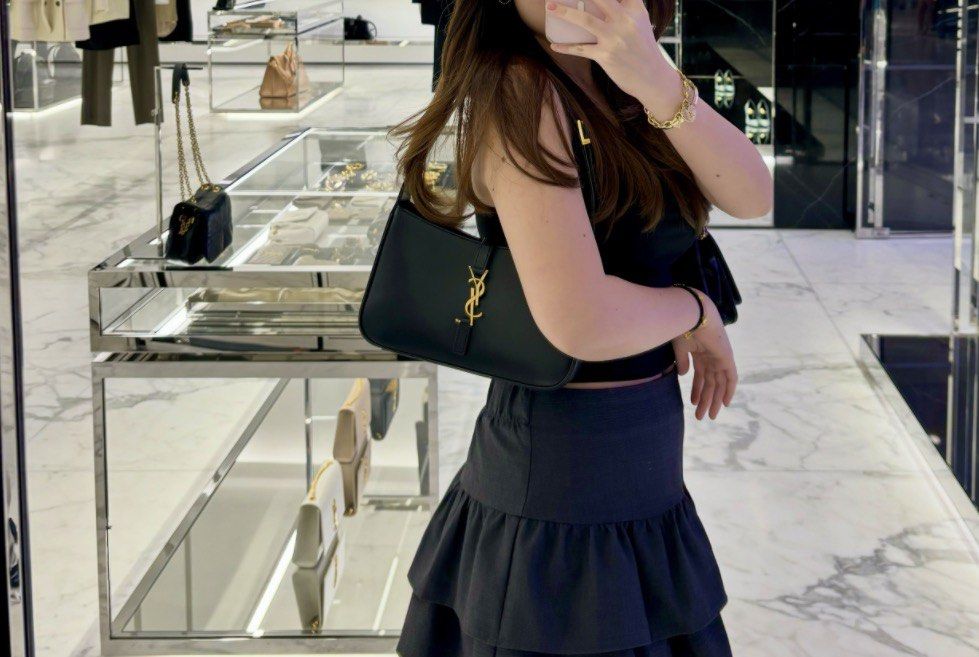 Authentic YSL LE 5 À 7 IN SMOOTH LEATHER BLACK (Category: Shoulder Bags) located in Quezon City. Submitted by emily_in_pariss (Listing ID 1466846274, Image 2). Description: Guaranteed Authentic Purchased in YSL Store Siam Paragon Bangkok Thailand Flaws: Small scratch infront not so noticeable in person The edges of handle in bag have small dents due to usage.