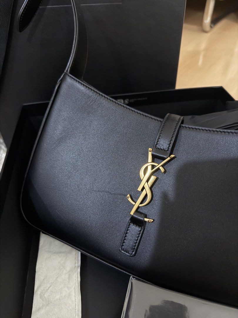 Authentic YSL LE 5 À 7 IN SMOOTH LEATHER BLACK (Category: Shoulder Bags) located in Quezon City. Submitted by emily_in_pariss (Listing ID 1466846274, Image 3). Description: Guaranteed Authentic Purchased in YSL Store Siam Paragon Bangkok Thailand Flaws: Small scratch infront not so noticeable in person The edges of handle in bag have small dents due to usage.