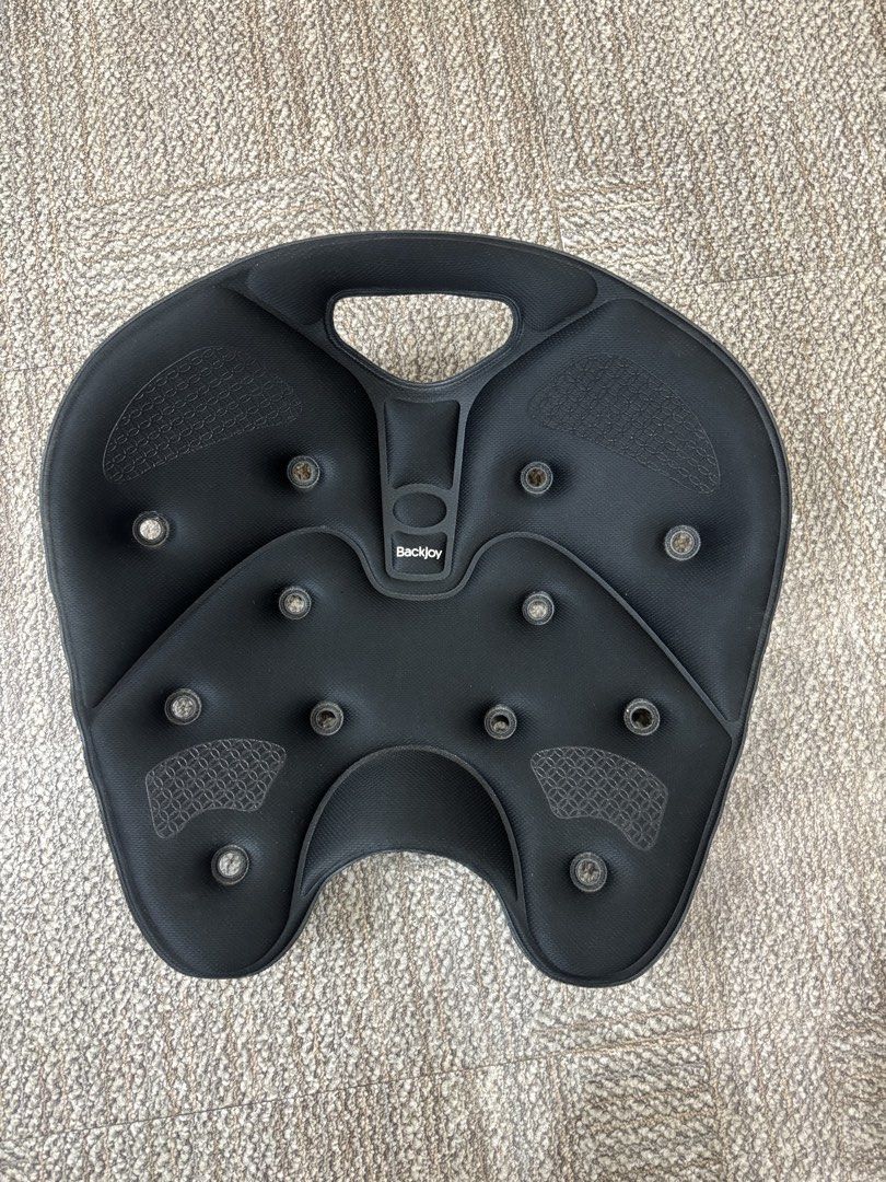 BackJoy SitSmart Core Posture Seat Black (Category: Braces, Support & Protection) located in Taguig. Submitted by grekoriog (Listing ID 1466792248, Image 2). Description: - Brand: BackJoy SitSmart Core 1.0 - Color: Classic Black - Condition: Good, clean with minimal wear - Design: Ergonomic contoured shape with ventilation holes and grab handle - Benefits: Instantly relieves back pain and corrects posture for pelvis and lower back - Versatility: 