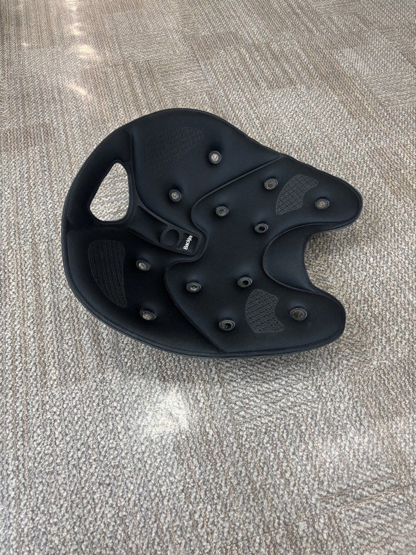 BackJoy SitSmart Core Posture Seat Black (Category: Braces, Support & Protection) located in Taguig. Submitted by grekoriog (Listing ID 1466792248, Image 1). Description: - Brand: BackJoy SitSmart Core 1.0 - Color: Classic Black - Condition: Good, clean with minimal wear - Design: Ergonomic contoured shape with ventilation holes and grab handle - Benefits: Instantly relieves back pain and corrects posture for pelvis and lower back - Versatility: 