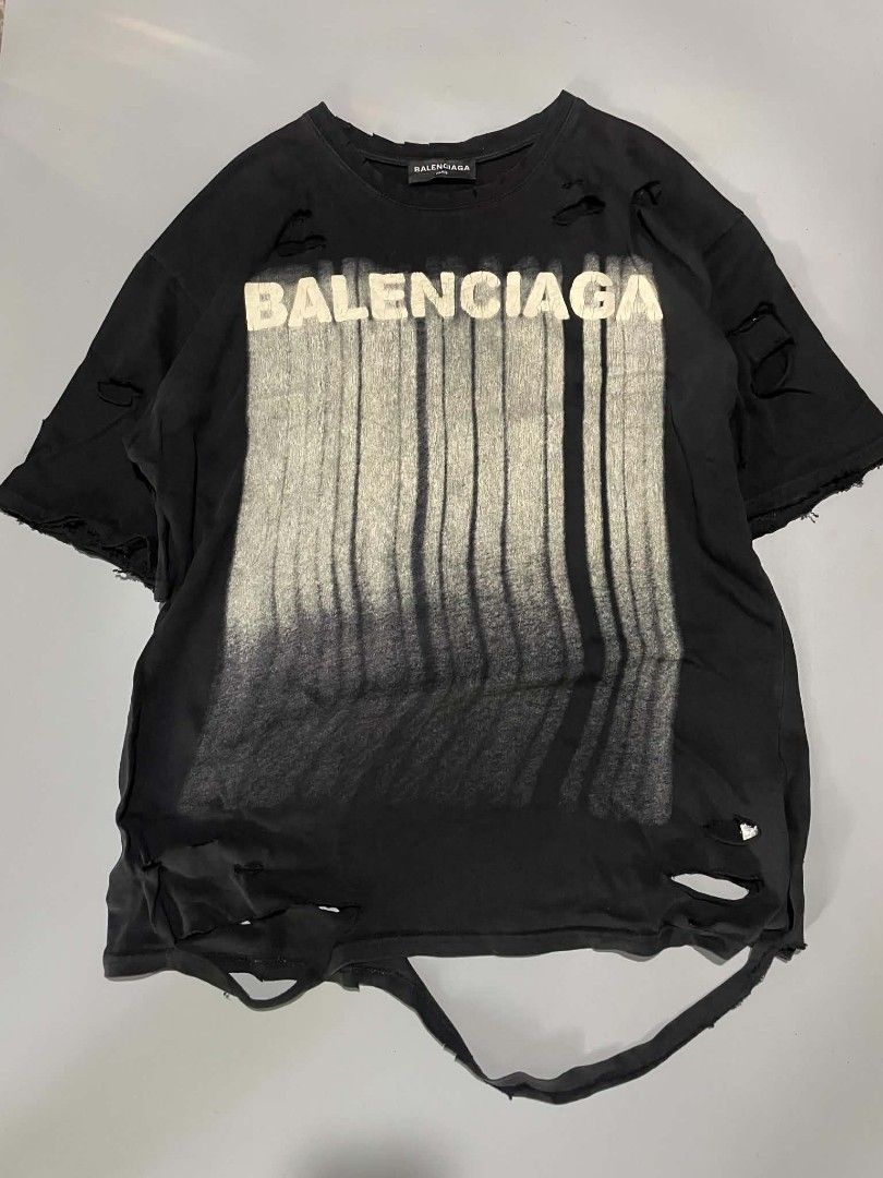 Balenciaga Distressed Tee (Category: Tshirts & Polo Shirts ) located in Cavite. Submitted by imgnr0 (Listing ID 1466845401, Image 1). Description: good condition check details pic dimes: 22x29 .