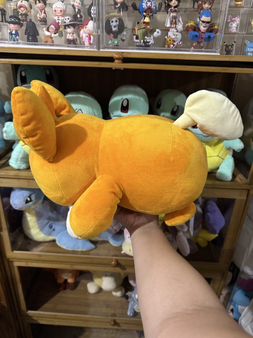 Banpresto Pawmi Pokémon Sleeping Plush (Category: Plushies & Soft Toys) located in Cainta. Submitted by mayhroeen (Listing ID 1466966319, Image 2). Description: Pawmi plush from Banpresto. Official tag attached, never removed. Super soft orange and cream fabric with embroidered facial features and paw pads. Approx medium size resting pose. Clean, smoke-free home storage. Great addition to any Pokémon collection..