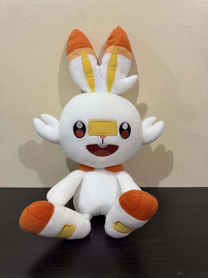 Banpresto Pokemon Scorbunny Plush (Category: Plushies & Soft Toys) located in Cainta. Submitted by mayhroeen (Listing ID 1466966339, Image 2). Description: - Official Banpresto Scorbunny plush - Complete with side tag - Features embroidered eyes, mouth, and stitched foot pads - Super soft fabric texture in sitting posture - Flawless, clean condition with no stains or loose threads.