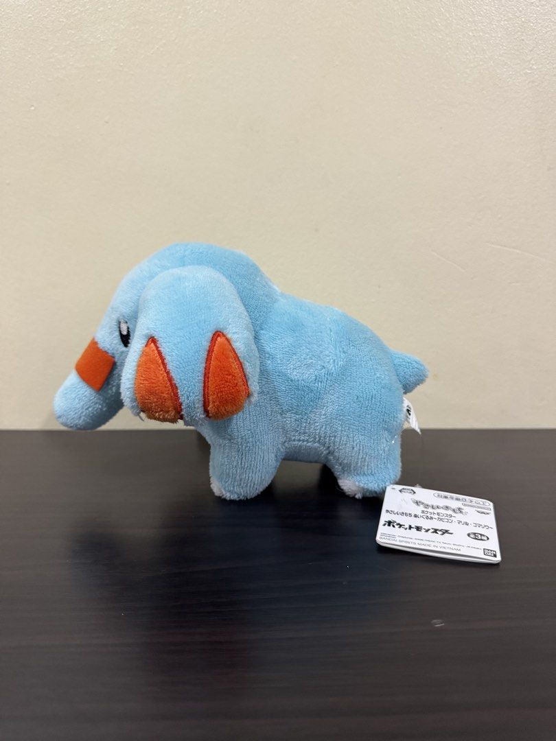 Banpresto Pokémon Phanpy Plush Toy (Category: Plushies & Soft Toys) located in Cainta. Submitted by mayhroeen (Listing ID 1466966348, Image 2). Description: - Item: Official Banpresto Pokémon Phanpy Plush - Condition: Brand new/clean, won straight from a claw machine - Authenticity: Official Nintendo merchandise with original paper tag and tush tag intact - Details: Soft blue fabric with signature orange accents on ears and snout - Origin: Made i