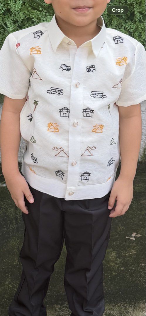 Barong Tagalog Kids (Category: Babies & Kids Fashion) located in Quezon City. Submitted by wonderrv18 (Listing ID 1466897979, Image 1). Description: - Style: Boys' short sleeve cream Barong Tagalog - Design: Embroidered Filipino cultural motifs (nipa huts, carabaos, jeepneys, mountains) - Details: Button-down front collar - Material: Lightweight and comfortable fabric - Perfect for: Cultural events, graduations, weddings, and formal occasions - U