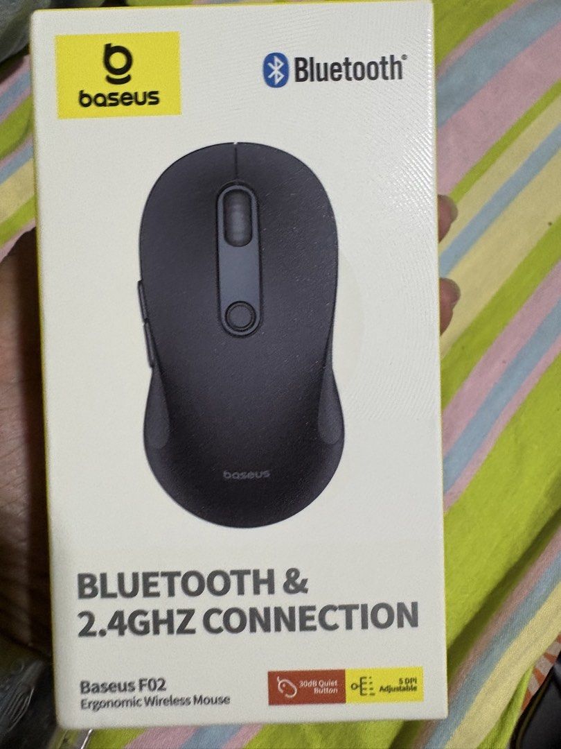 Baseus F02 Ergonomic Wireless Mouse Bluetooth 2.4GHz (Category: Mouse & Mousepads) located in Bacoor. Submitted by cathshoppit (Listing ID 1466968321, Image 1). Description: Baseus F02 ergonomic wireless mouse in dark grey. Dual-mode connection supports Bluetooth 5.2 and 2.4GHz USB receiver. 30dB quiet buttons won't disturb people around you. 1600-4000 adjustable DPI settings for smooth tracking across PCs, laptops, and tablets. Comfortable conto