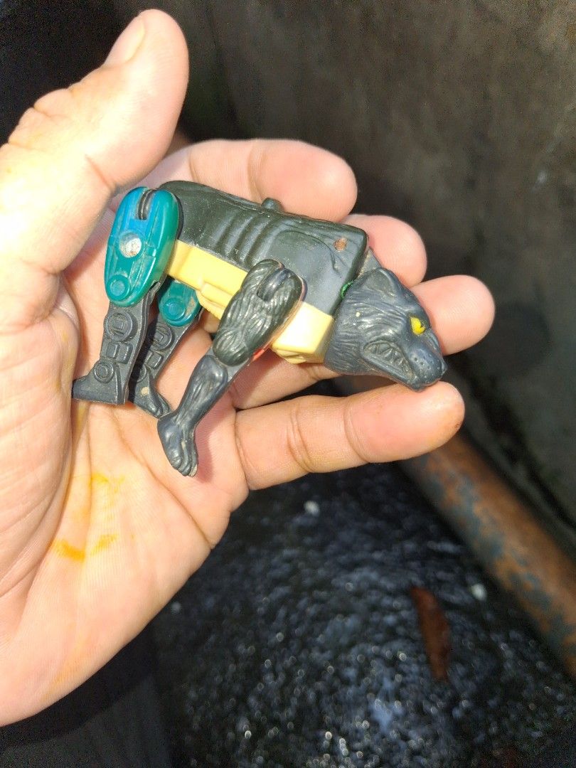 Beast Wars happy meal 1996 takara (Category: Action & Battle Toys) located in Manila. Submitted by marcas022798212 (Listing ID 1466841789, Image 2). Description: - Vintage 1996 Takara Black Wolf robot toy (stamped Takara and CW) - Striking yellow eyes with yellow and green body accents - Fully posable legs for dynamic posing - Condition: Shows minor dust accumulation from storage and light paint wear on metal screws - Perfect addition for retro t