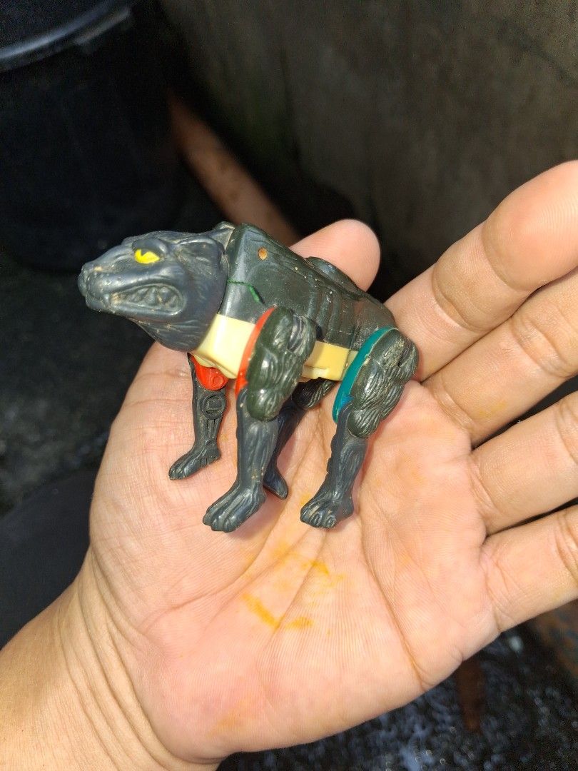Beast Wars happy meal 1996 takara (Category: Action & Battle Toys) located in Manila. Submitted by marcas022798212 (Listing ID 1466841789, Image 1). Description: - Vintage 1996 Takara Black Wolf robot toy (stamped Takara and CW) - Striking yellow eyes with yellow and green body accents - Fully posable legs for dynamic posing - Condition: Shows minor dust accumulation from storage and light paint wear on metal screws - Perfect addition for retro t