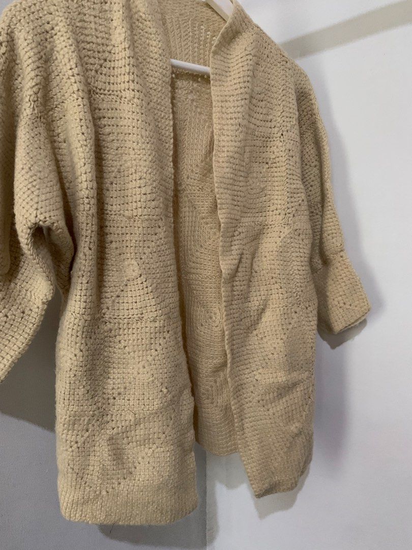 Beige Crochet Open Front Cardigan (Category: Coats, Jackets and Outerwear) located in Manila. Submitted by spaceshop12345 (Listing ID 1466867385, Image 2). Description: - Color: Neutral beige - Design: Open front with relaxed fit and dropped shoulders - Style: Mid-length with a textured crochet knit pattern - Versatility: Perfect for layering over any casual outfit - Condition: Great for extra warmth and everyday wear.