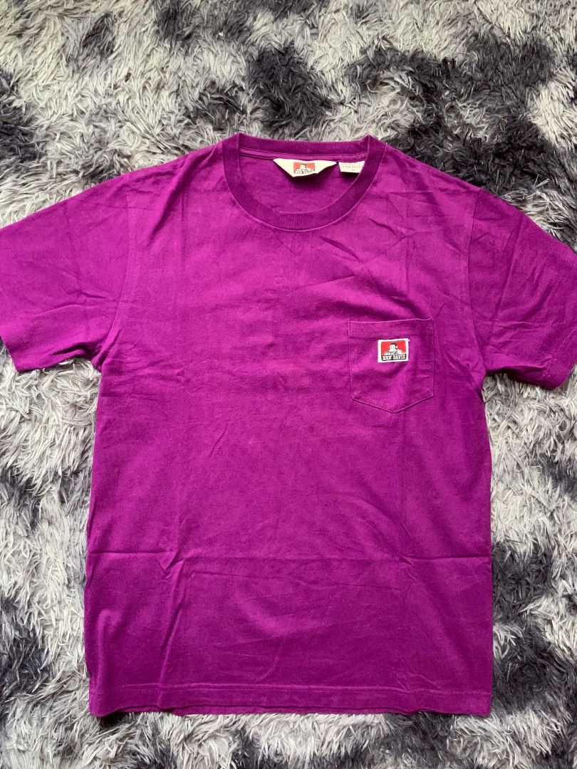 Ben Davis Purple Pocket T-Shirt Size M (Category: Tshirts & Polo Shirts ) located in Pagadian. Submitted by duskthrift (Listing ID 1466775310, Image 1). Description: - Brand: Ben Davis - Color: Bright Purple - Size: Medium (M) - Material: 100% Cotton - Design: Short sleeves, crew neckline, and chest pocket with classic monkey logo patch - Origin: Made in China - Condition: Clean fabric throughout, well-maintained.