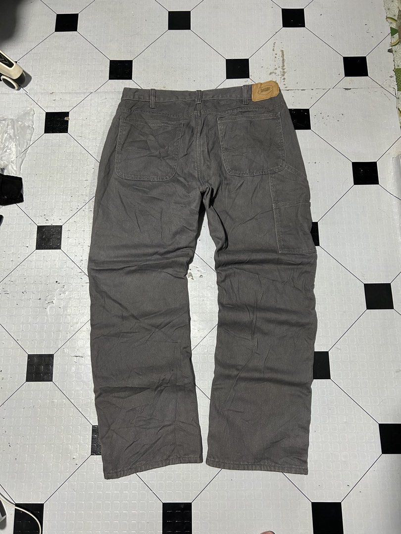 Berkley Jensen Flannel Lined Work Pants Gray 34x30 (Category: Jeans) located in San Simon. Submitted by ericdeinla69664 (Listing ID 1466793524, Image 1). Description: - Brand/Model: Berkley Jensen gray canvas work pants - Size: 34x30 (Normal fit, straight leg cut) - Warm Lining: Black and white plaid fleece interior for cold days - Storage: Convenient utility pockets on the side legs - Details: Back leather logo patch - Durability: Heavy-duty bui