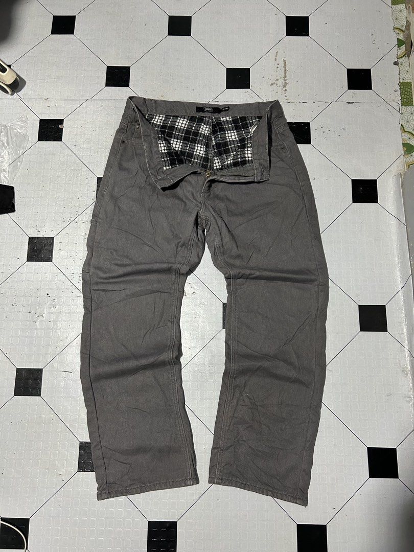 Berkley Jensen Flannel Lined Work Pants Gray 34x30 (Category: Jeans) located in San Simon. Submitted by ericdeinla69664 (Listing ID 1466793524, Image 2). Description: - Brand/Model: Berkley Jensen gray canvas work pants - Size: 34x30 (Normal fit, straight leg cut) - Warm Lining: Black and white plaid fleece interior for cold days - Storage: Convenient utility pockets on the side legs - Details: Back leather logo patch - Durability: Heavy-duty bui