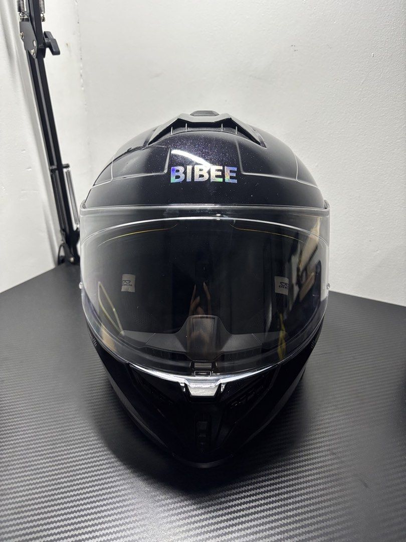 BIBEE Black Glitter Motorcycle Helmet with Dual Visors DOT ECE (Category: Helmets and other Riding Gears) located in Manila. Submitted by jezzierain17683 (Listing ID 1466941129, Image 1). Description: BIBEE PHANTOM FULL-FACE HELMET ✔️ Brand: BIBEE ✔️ Model: Phantom ✔️ Full-face helmet ✔️ Glossy Black ✔️ Gold/Orange mirror visor ✔️ Clear outer visor ✔️ Dual visors ✔️ Sporty aerodynamic design ✔️ Comfortable padded interior ✔️ Front ventilation ✔️ 