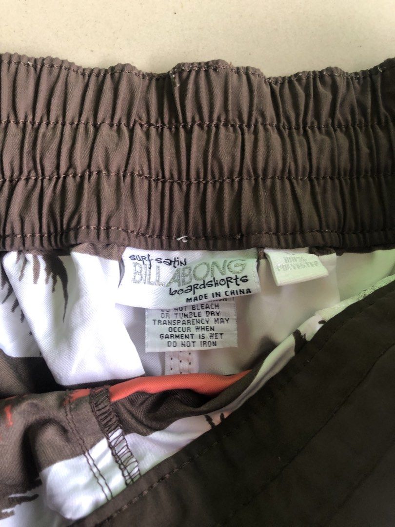 Billabong Surf Satin Boardshorts (Category: Shorts) located in Cagayan de Oro. Submitted by leklekthrift (Listing ID 1466891356, Image 3). Description: Billabong surf satin boardshorts with a cool palm tree tropical print. Brown, white, red, and yellow stripes. Elastic waistband with drawstring closure. Soft material, great for the beach or pool days. Made in China..