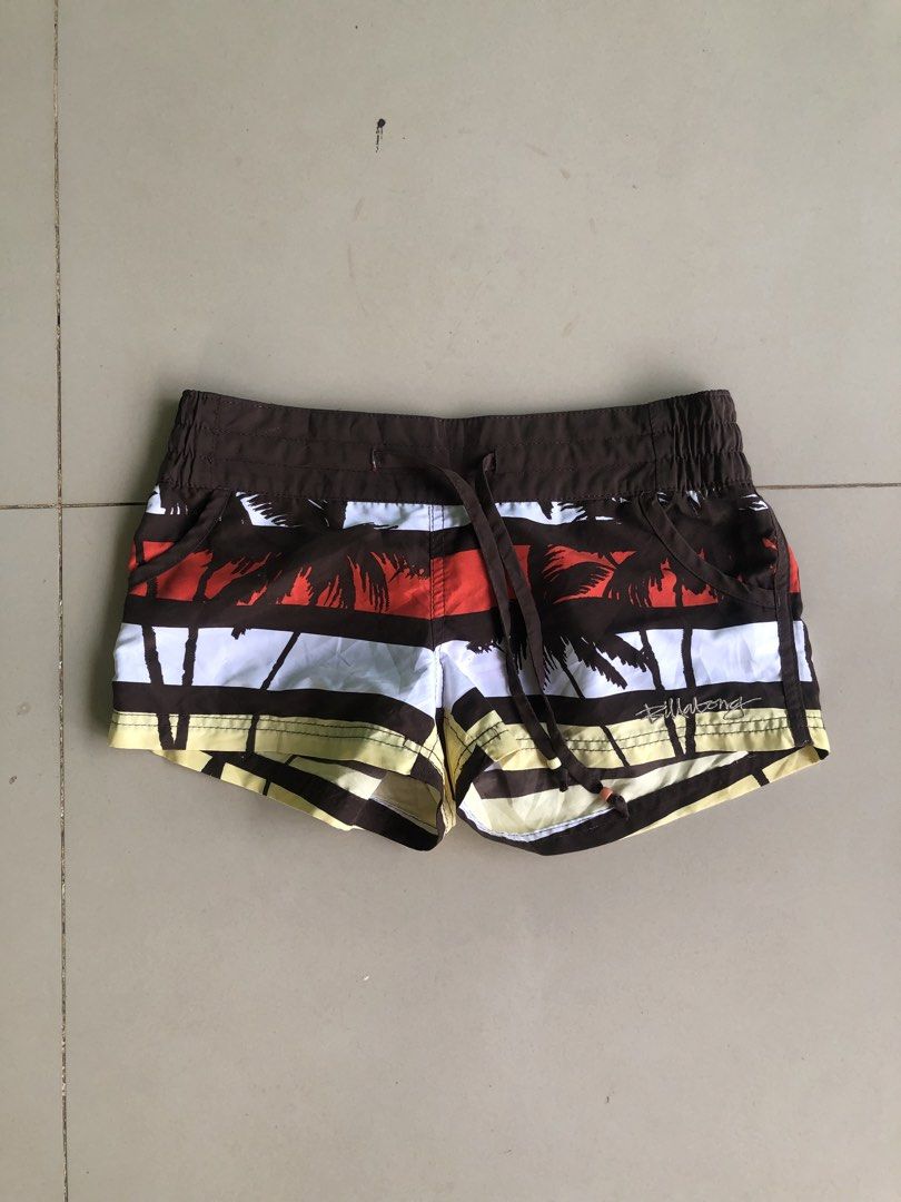 Billabong Surf Satin Boardshorts (Category: Shorts) located in Cagayan de Oro. Submitted by leklekthrift (Listing ID 1466891356, Image 2). Description: Billabong surf satin boardshorts with a cool palm tree tropical print. Brown, white, red, and yellow stripes. Elastic waistband with drawstring closure. Soft material, great for the beach or pool days. Made in China..