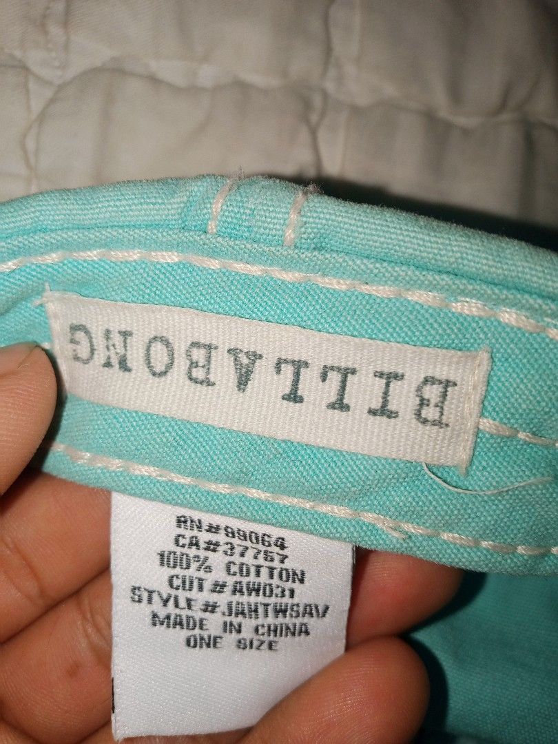 Billabong Turquoise Bull Skull Cap Hat One Size (Category: Caps & Hats) located in Allen. Submitted by milyonaryung_gipit (Listing ID 1466793596, Image 3). Description: Billabong cap in turquoise and white canvas. Bull skull graphic printed across the front panel with colorful geometric details. White contrast stitching along the panels and brim. Made of 100 percent cotton. Adjustable back strap with fabric label tag. Spot clean only per the inne
