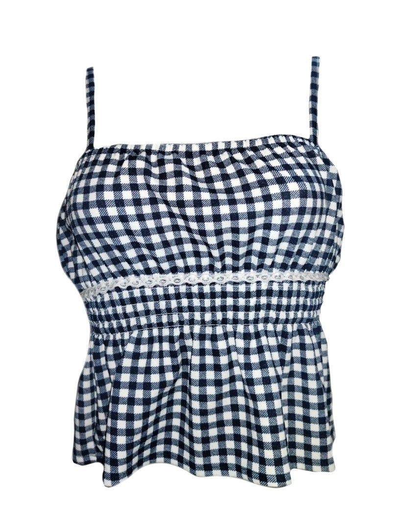 Black and white gingham spaghetti strap cami top (Category: Sleeveless) located in Manila. Submitted by thriftythreads1903 (Listing ID 1466931497, Image 1). Description: - Classic black and white check pattern - Square neckline with adjustable thin spaghetti straps - Stretchy smocked bodice for a comfortable, fitted look - Cute white lace trim detail across the front - Flared ruffle hem for a fun, breezy vibe - Ideal for sunny weather and easy to