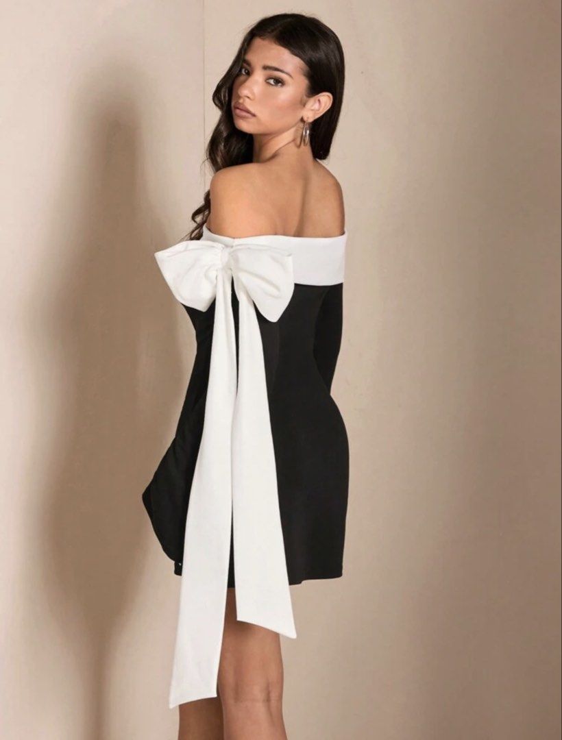 Black and White Off-Shoulder Mini Dress with Bow (Category: Dresses) located in Pasay City. Submitted by ohjhayy (Listing ID 1466857430, Image 2). Description: - Style: Black and white off-shoulder mini dress - Design: Long sleeves with trendy flared cuffs - Feature: Stunning large white bow on the back with long flowing ribbons - Fit: Fitted bodycon silhouette that flatters your figure - Fabric: Smooth, comfortable material - Occasion: Ideal par