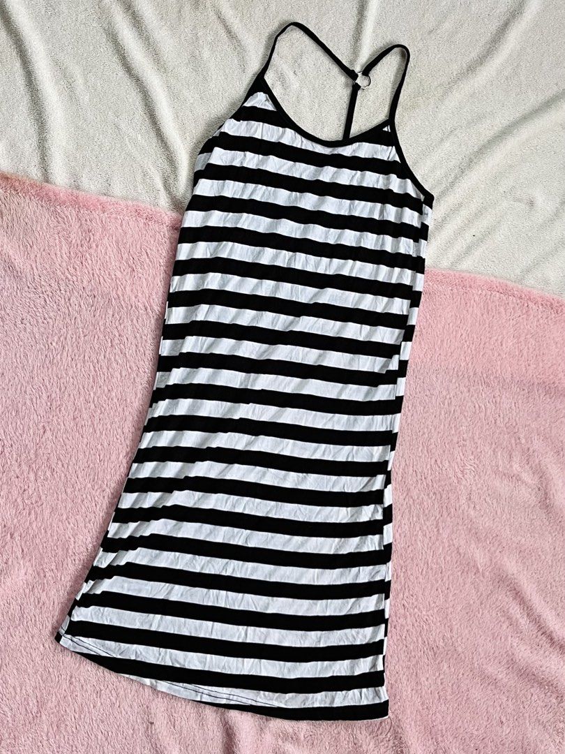 Black and White Striped Dress (Category: Dresses) located in Valenzuela. Submitted by closettee_ (Listing ID 1466886938, Image 1). Description: - Design: Classic black and white horizontal stripes - Fit: Stretchy, comfortable long bodycon maxi cut - Details: Spaghetti straps with a chic racerback ring connector - Style: Perfect for casual days out, easy to pair with sneakers or sandals.