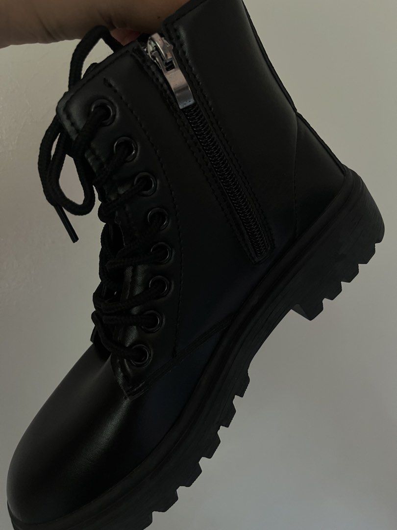 Black combat boots with side zipper and laces (Category: Boots) located in Manila. Submitted by epiccloud_1897cb (Listing ID 1466800293, Image 2). Description: - Color: Classic black (goes with everything) - Design: Mid-calf height with smooth upper material - Closure: Lace-up front + handy side zipper for easy on/off - Sole & Heel: Chunky lug sole with a sturdy block heel - Style: Great for edgy outfits and ideal daily footwear for cooler weathe