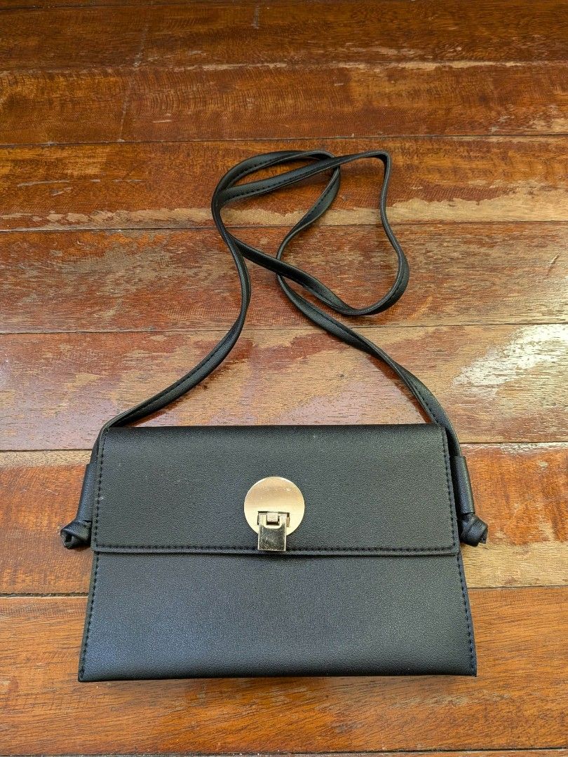 Black Crossbody Bags (Category: Cross-body Bags) located in Pasig City. Submitted by cxdwr_ (Listing ID 1466838387, Image 2). Description: - TWO small black sling bags - synthetic leather - issues: bag with chain design has stains - 120 for two bags.