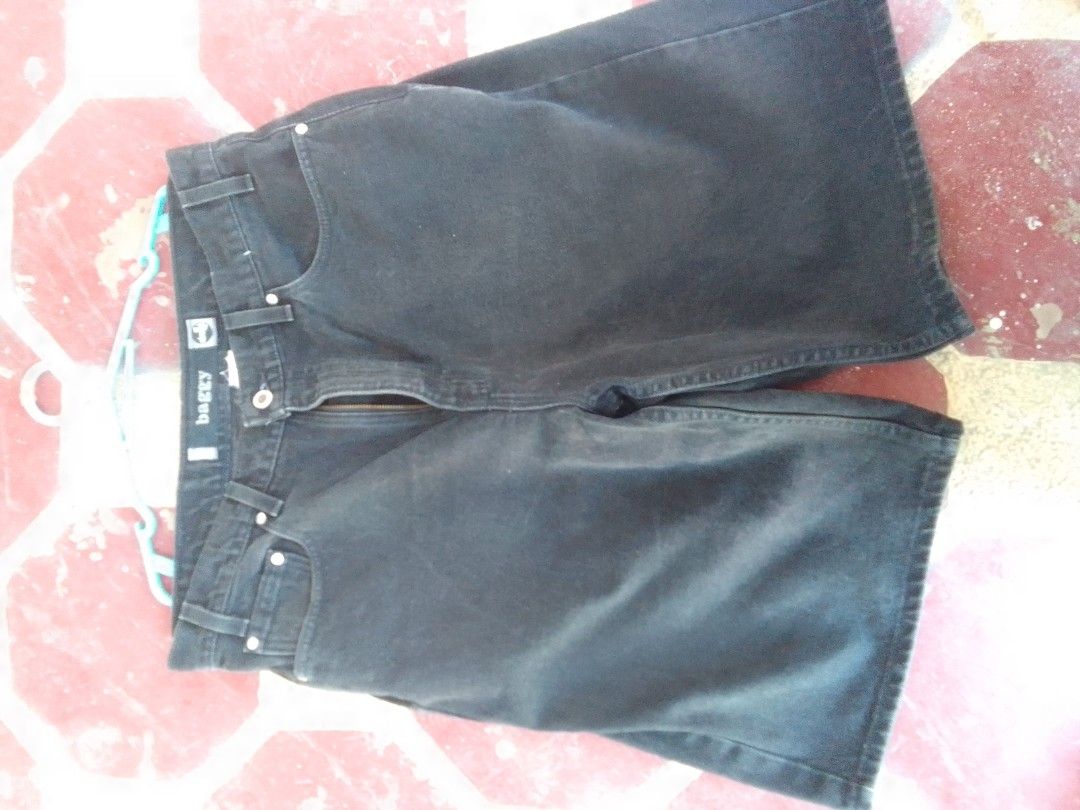 Black denim baggy shorts (Category: Shorts) located in Manila. Submitted by max_444 (Listing ID 1466887593, Image 2). Description: - Style: Baggy fit denim shorts with a mid-length cut - Color/Wash: Black dark wash with a subtle vintage fade - Details: Classic five-pocket style, metal button closure, and zip fly - Features: Waistband with belt loops - Condition: Brand new / Excellent quality - Perfect for: Casual, streetwear, and everyday wear -S
