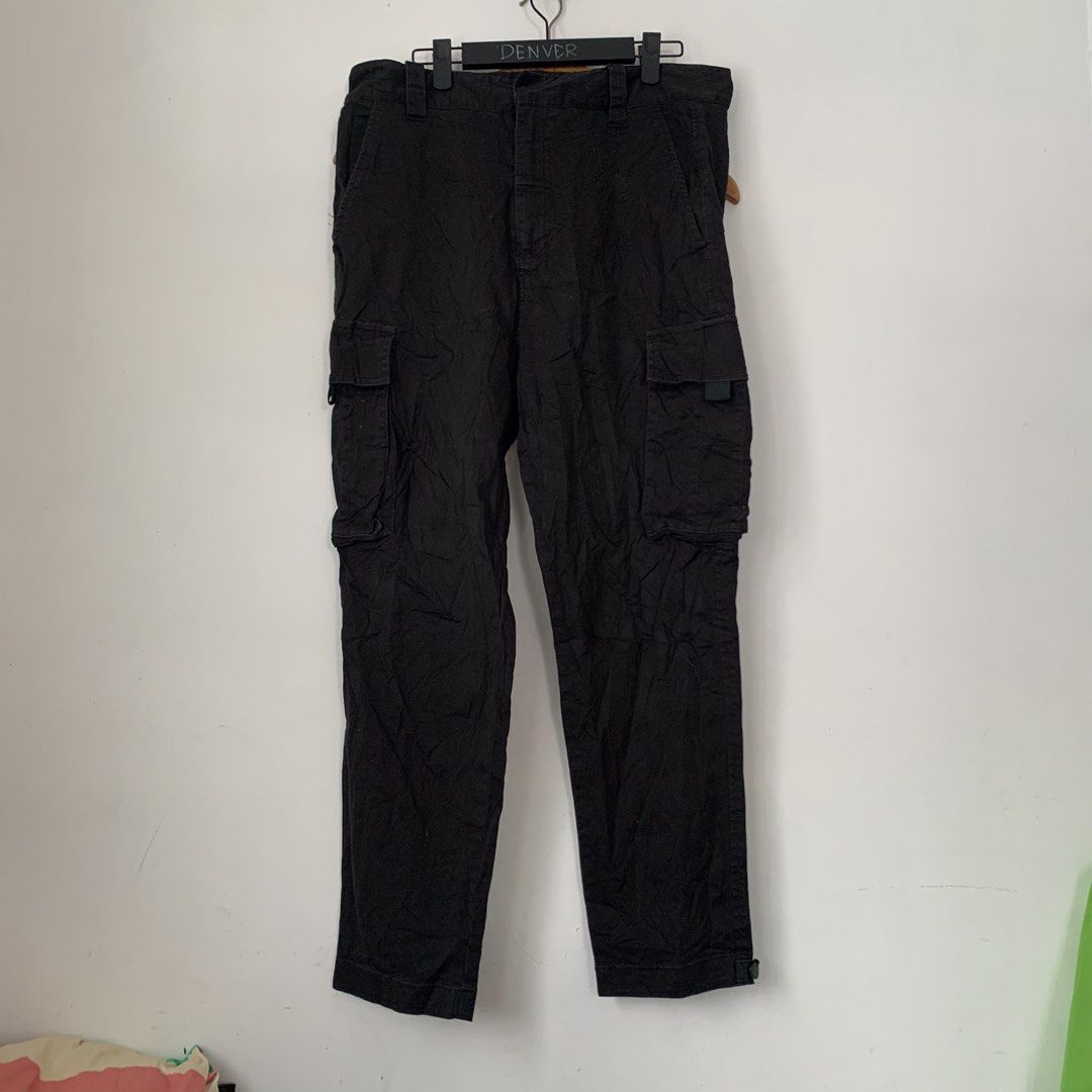 Black Dior Cargo Pants (Category: Joggers) located in Manila. Submitted by gentleflower-74686a (Listing ID 1466970601, Image 1). Description: - Color: Solid black - Fit: Straight leg cut, ideal for streetwear - Waistline: 34 / Length: 38 - Pockets: Multiple utility pockets on the sides - Details: Subtle Dior brand patch near the back pocket - Cuffs: Adjustable snap buttons to change the hem fit - Condition: Normal wear.